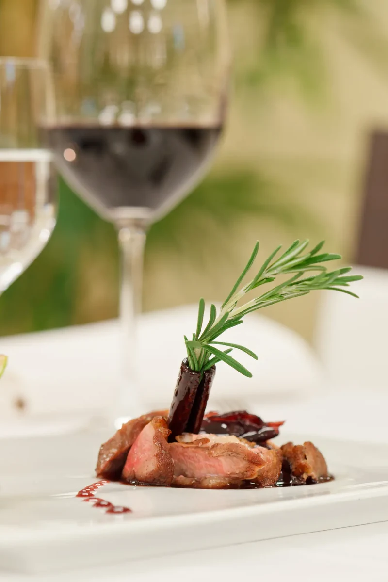 A plated dish at a Palmilla restaurant table, moments beyond the gate.