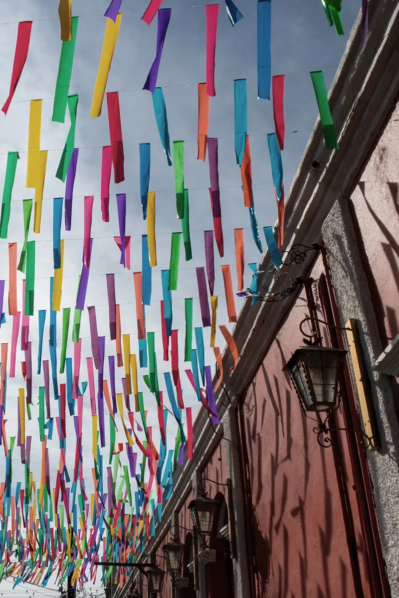 Papel picado banners strung over a San José del Cabo street in the gallery district.