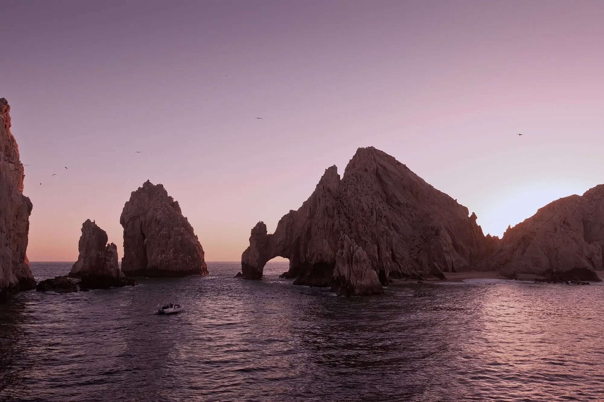 El Arco at Land's End, Cabo San Lucas, the rock arch glowing over the sea at sunset.